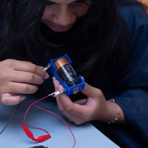 Student using battery
