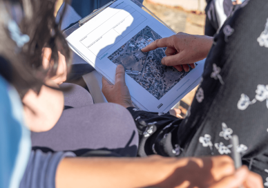 Teacher showing a student a map