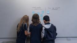 Students working on a whiteboard