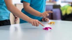 Origami frogs played with by students