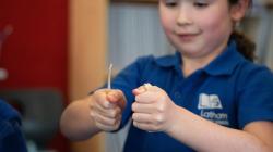 Student demonstrates snapping a stick