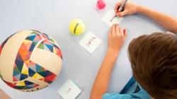 Student writing on cards