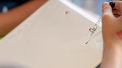 Liquids being placed on a sheet with an eyedropper
