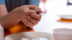 Student holds melting ice in their hands
