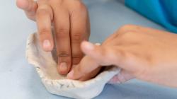 Student works with clay