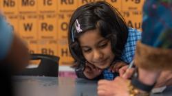 Student observes closely