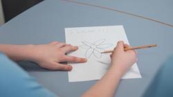 Student draws a flower