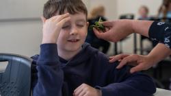 Student focuses with closed eyes